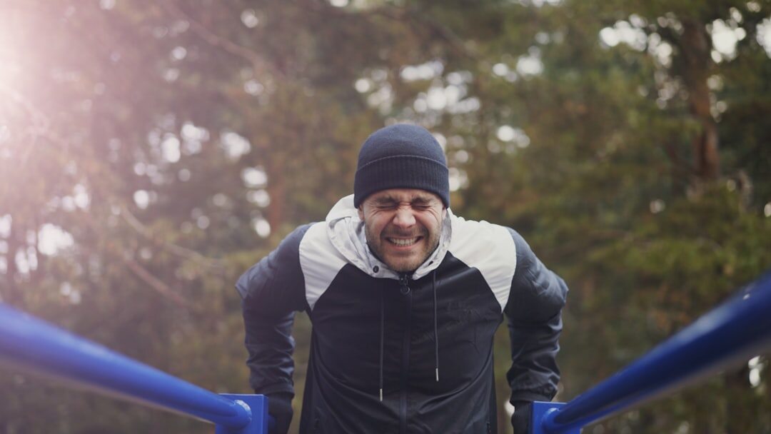 senior man stretching outdoors