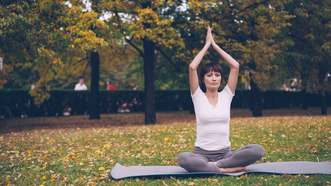 senior doing yoga outdoors